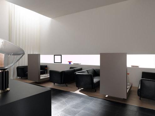 Hotellobby mit Trennwänden aus Holz Hotellobby mit Trennwänden aus Holz und schwarzen Ledersofas